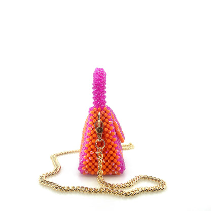 pink and orange stripe beaded handbag with gold chain. on white background