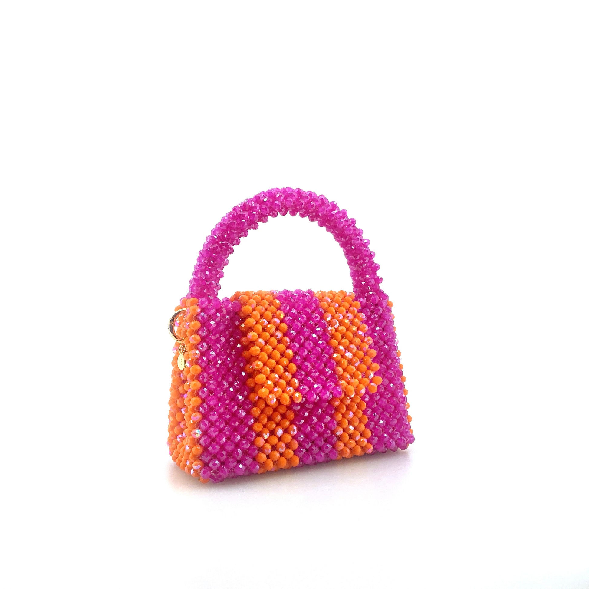 pink and orange stripe beaded handbag. on white background