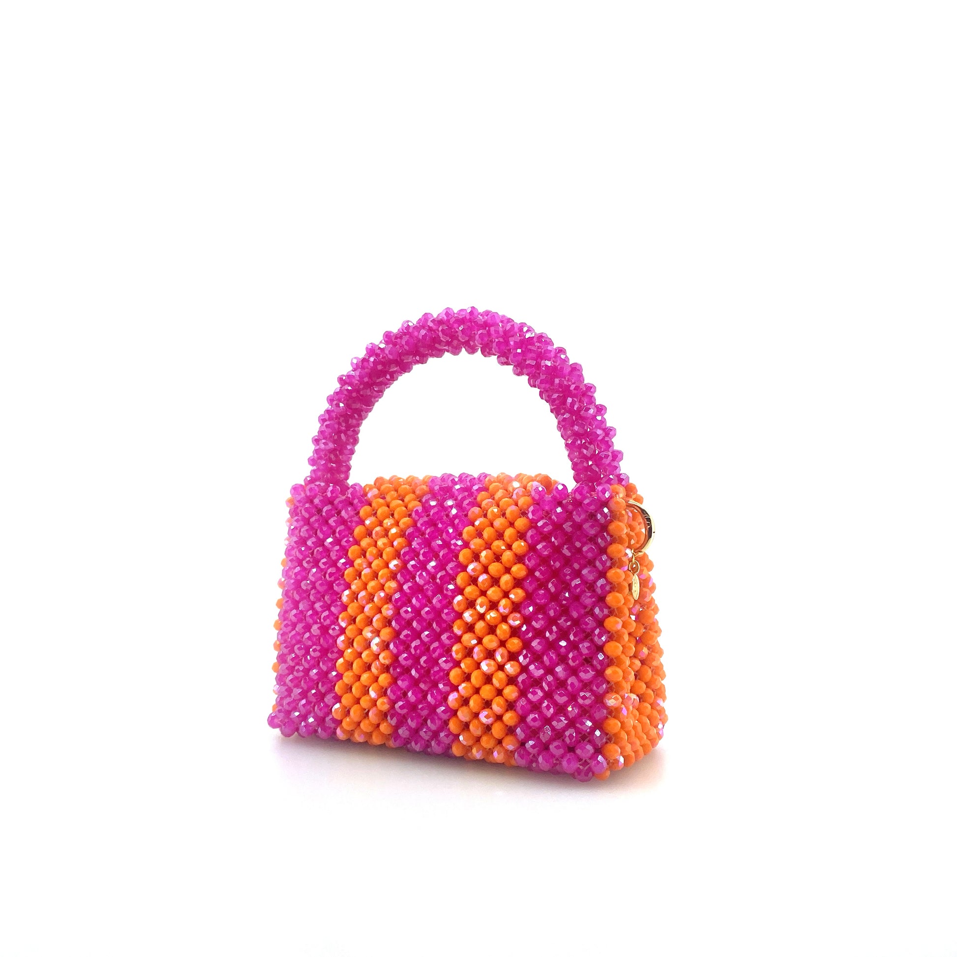 pink and orange stripe beaded handbag. on white background