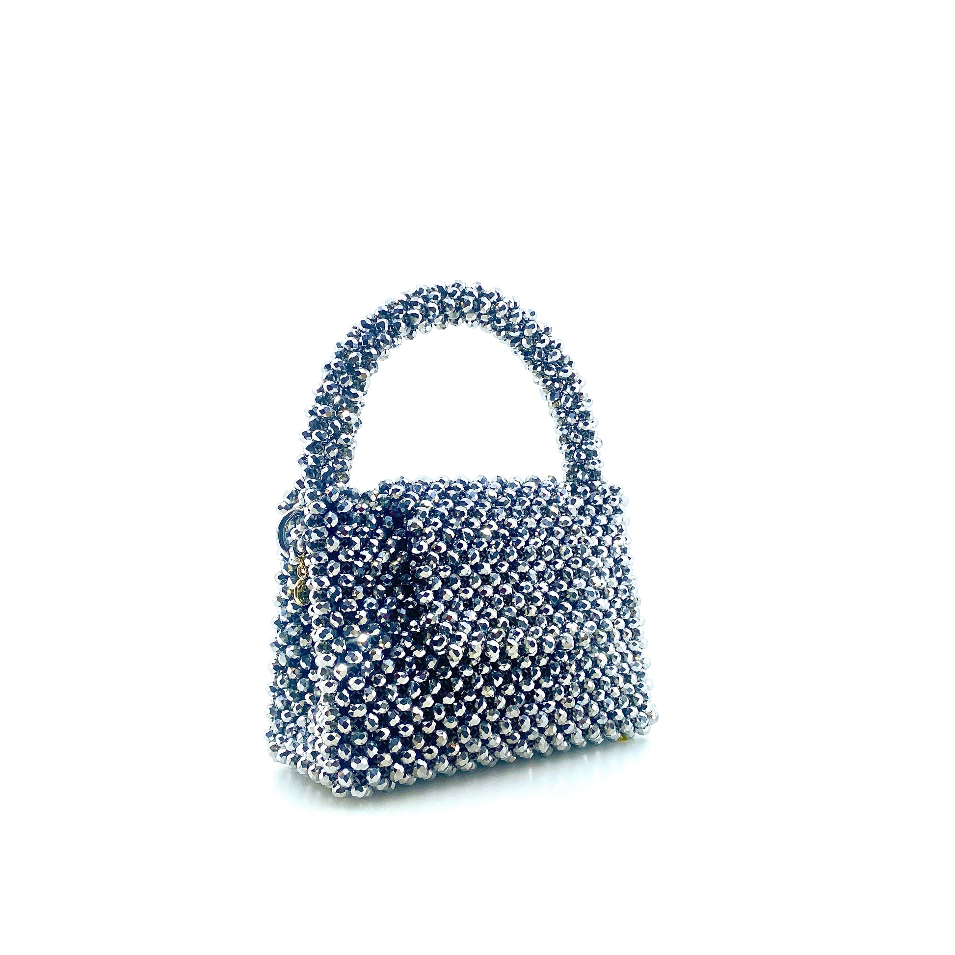 silver beaded handbag on white background