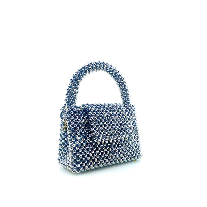 silver beaded handbag on white background