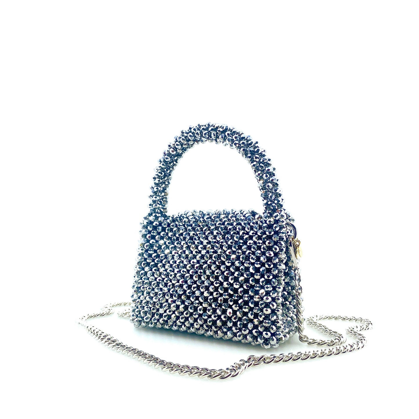 silver beaded handbag with silver chain. on white background