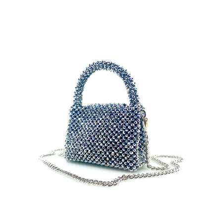 silver beaded handbag with silver chain. on white background
