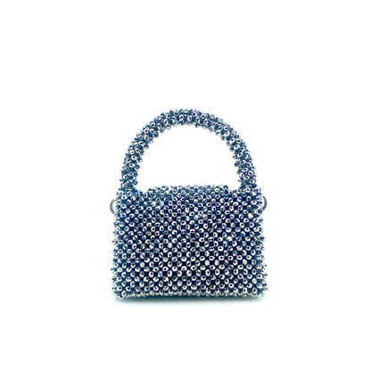 silver beaded handbag on white background