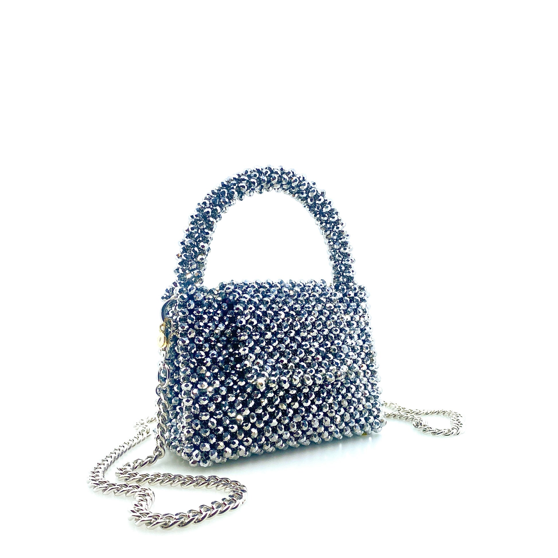 silver beaded handbag with silver chain. on white background