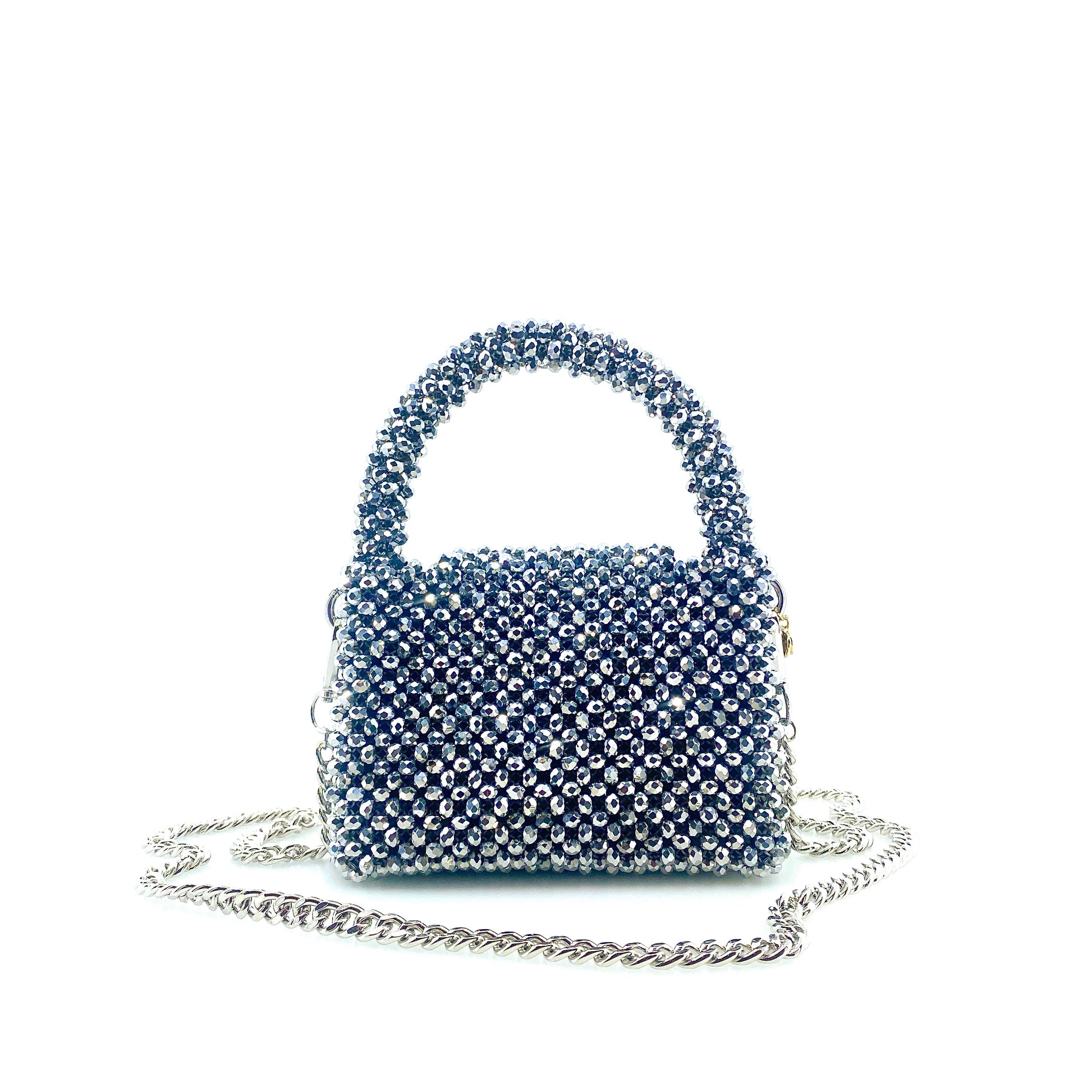silver beaded handbag with silver chain. on white background