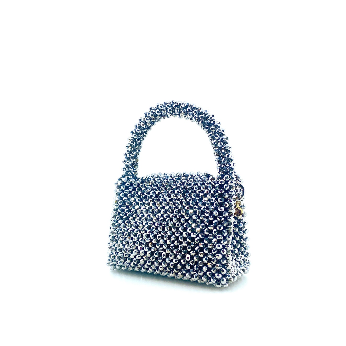 silver beaded handbag on white background