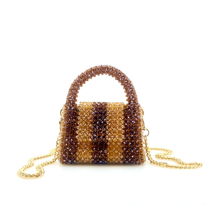 rotating image of brown and beige stripe beaded handbag with gold chain. on white background
