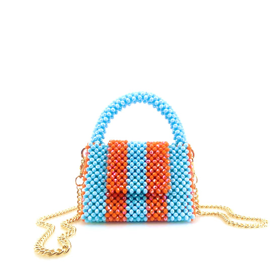 rotating image of blue and orange stripe beaded handbag with gold chain. on white background