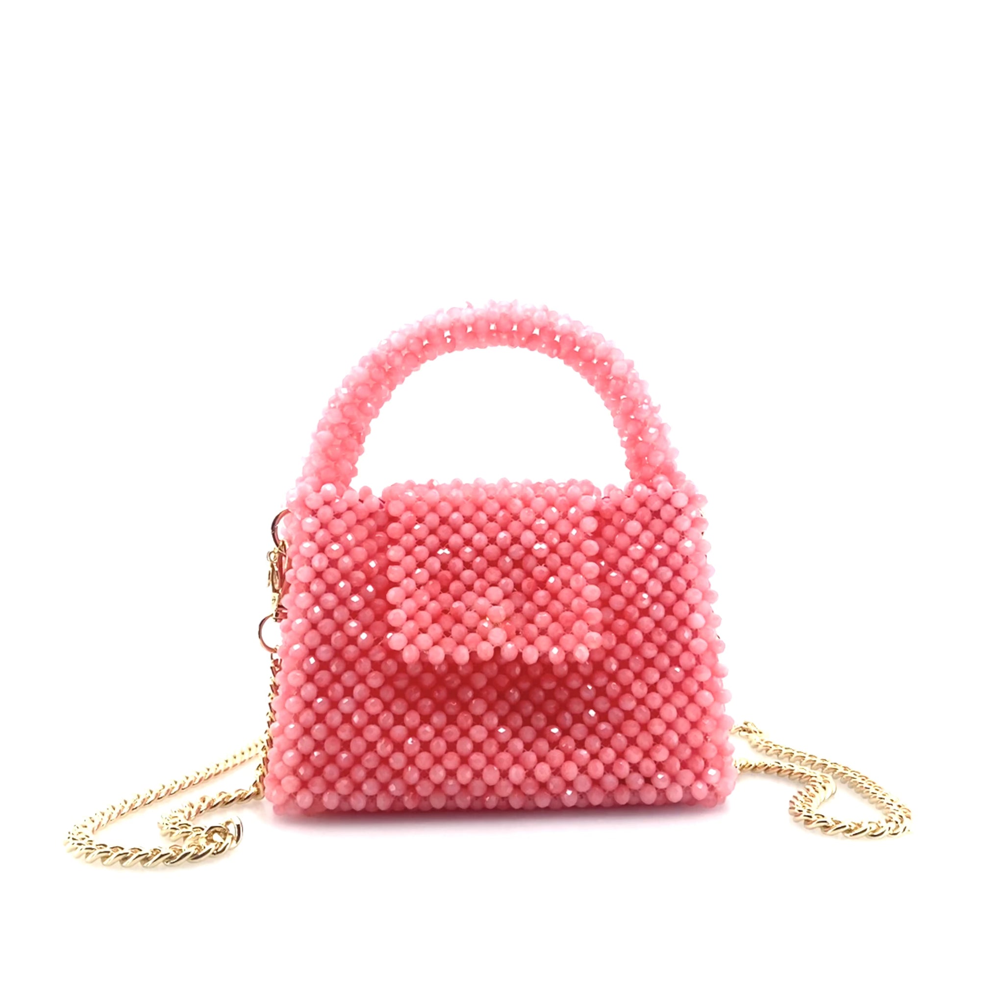 rotating image of pink beaded handbag with gold chain. on white background