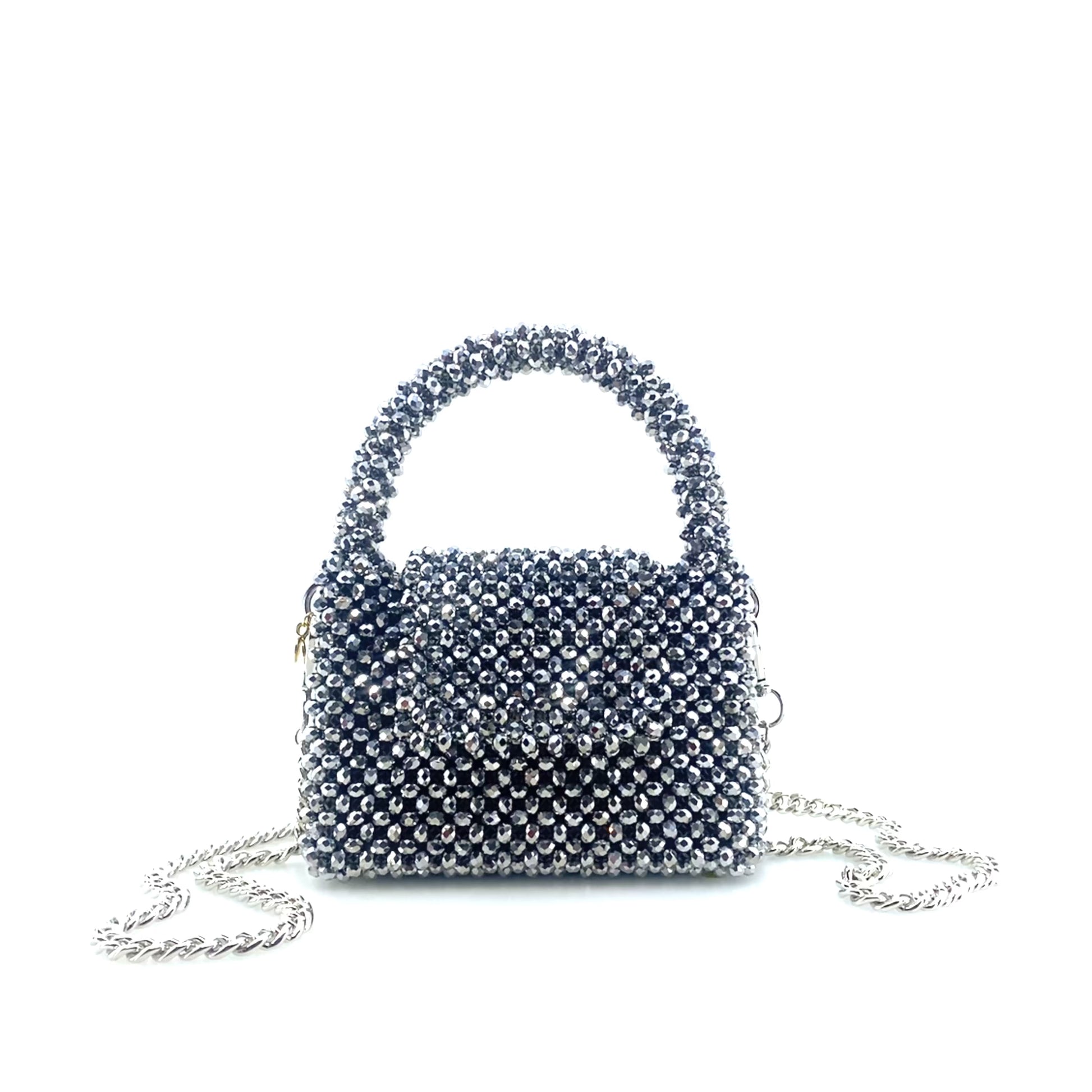 rotating image of silver beaded handbag with silver chain. on white background