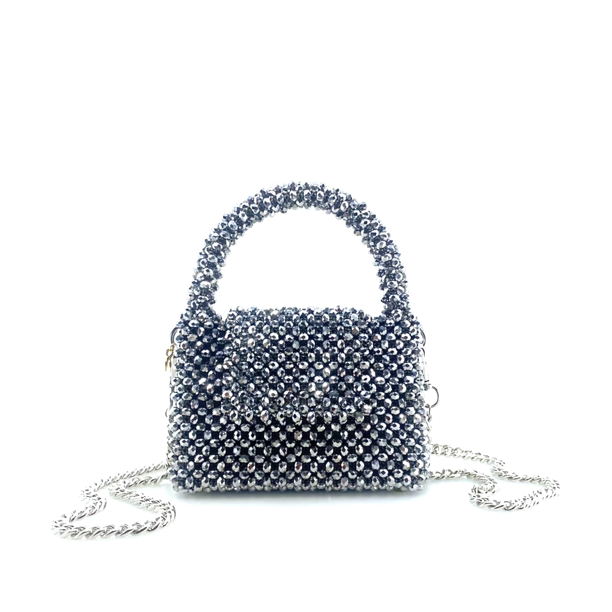 rotating image of silver beaded handbag with silver chain. on white background